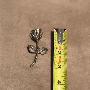Silver tone rose pin